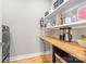 Well-organized pantry with a mini-fridge, a coffee station, ample shelving and storage at 327 S Turner Ave, Charlotte, NC 28208