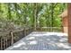 Relaxing back deck overlooking lush trees offering privacy and shade at 3730 Monique Ln, Charlotte, NC 28210