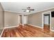 Bedroom featuring hardwood floors, a ceiling fan, and neutral walls at 3730 Monique Ln, Charlotte, NC 28210