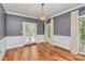 Dining room with hardwood floors, modern light fixture, and French doors leading to outdoors at 3730 Monique Ln, Charlotte, NC 28210