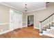 Inviting foyer with hardwood floors, staircase, and natural light, offering a warm welcome at 3730 Monique Ln, Charlotte, NC 28210