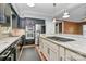 Modern kitchen with stainless steel appliances and open layout to living space at 3730 Monique Ln, Charlotte, NC 28210