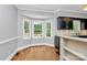 Bright breakfast nook with bay windows and adjacent kitchen area with modern finishes at 3730 Monique Ln, Charlotte, NC 28210