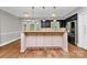 Modern kitchen island with granite counters, stainless steel appliances, and breakfast nook at 3730 Monique Ln, Charlotte, NC 28210