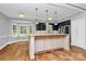 Bright kitchen with island, granite countertops, stainless steel appliances, and breakfast nook at 3730 Monique Ln, Charlotte, NC 28210