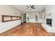 Bright living room featuring hardwood floors, a fireplace, and views of the outdoors at 3730 Monique Ln, Charlotte, NC 28210