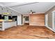 Spacious living room features hardwood floors, modern lighting, and adjacent kitchen with island at 3730 Monique Ln, Charlotte, NC 28210