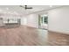 Spacious basement featuring vinyl floors, kitchenette, and walkout patio at 416 Plantation Way # 3, Mount Gilead, NC 27306