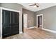 Basement with woodgrain flooring and views of bathroom and closet doors at 416 Plantation Way # 3, Mount Gilead, NC 27306