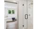 Modern bathroom with a glass-enclosed shower featuring white subway tile and a separate soaking tub at 416 Plantation Way # 3, Mount Gilead, NC 27306