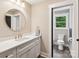 Bathroom featuring a round mirror, marble countertop, and modern fixtures at 416 Plantation Way # 3, Mount Gilead, NC 27306