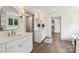 Luxurious bathroom with double vanity, wood-look flooring, and access to a walk-in closet at 416 Plantation Way # 3, Mount Gilead, NC 27306