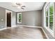 Spacious bedroom with hardwood floors, natural light, and two windows at 416 Plantation Way # 3, Mount Gilead, NC 27306