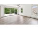 Light-filled bedroom with sliding doors to a deck overlooking a lush, wooded backyard at 416 Plantation Way # 3, Mount Gilead, NC 27306