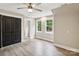 Inviting bedroom featuring wood-look floors, double windows, and a large closet at 416 Plantation Way # 3, Mount Gilead, NC 27306
