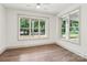 Bright bedroom with large windows offering scenic outdoor views and wood-look flooring at 416 Plantation Way # 3, Mount Gilead, NC 27306