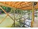 Interior view of a covered boat dock on a lake with natural wooden beams at 416 Plantation Way # 3, Mount Gilead, NC 27306