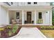 Charming front porch featuring decorative columns and seating area at 416 Plantation Way # 3, Mount Gilead, NC 27306