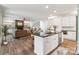 Modern kitchen and living room with stainless steel appliances and fixtures at 416 Plantation Way # 3, Mount Gilead, NC 27306