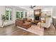 Spacious living room with a fireplace, and a leather sofa at 416 Plantation Way # 3, Mount Gilead, NC 27306