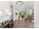 Open-concept living room featuring hardwood floors and neutral color palette at 416 Plantation Way # 3, Mount Gilead, NC 27306