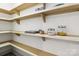 Walk-in pantry with wooden shelving providing ample space for food storage at 416 Plantation Way # 3, Mount Gilead, NC 27306