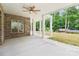 Covered patio with brick accents and a ceiling fan, perfect for outdoor entertaining at 416 Plantation Way # 3, Mount Gilead, NC 27306