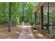 Secluded backyard features brick patio, grilling area, and wooded backdrop at 4263 Rambling Rose Ln # 23, Rock Hill, SC 29732