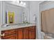 Bright bathroom featuring gray walls, a large mirror, stone counters and a shower at 4263 Rambling Rose Ln # 23, Rock Hill, SC 29732