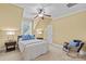 Bedroom with sloped ceilings, ceiling fan, a bed, and a comfortable chair at 4263 Rambling Rose Ln # 23, Rock Hill, SC 29732