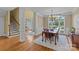 Spacious dining room with hardwood floors, chandelier, and large windows at 4263 Rambling Rose Ln # 23, Rock Hill, SC 29732