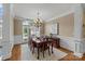Formal dining room with chandelier, wainscoting, and ample natural light at 4263 Rambling Rose Ln # 23, Rock Hill, SC 29732