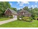 Stunning brick home featuring a three-car garage and beautiful landscaping at 4263 Rambling Rose Ln # 23, Rock Hill, SC 29732