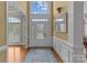 Elegant foyer with high ceilings, hardwood floors, and a decorative front door at 4263 Rambling Rose Ln # 23, Rock Hill, SC 29732