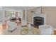Bright living room with fireplace, natural light, and dining room access at 4263 Rambling Rose Ln # 23, Rock Hill, SC 29732
