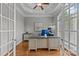 Home office with built-in desk, coffered ceiling, and hardwood floors at 4263 Rambling Rose Ln # 23, Rock Hill, SC 29732