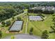Overhead view of tennis courts surrounded by green space and trees at 4263 Rambling Rose Ln # 23, Rock Hill, SC 29732
