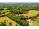 Beautiful aerial view of property showcasing expansive acreage, surrounded by lush greenery and mature trees at 4275 Herman Sipe Rd, Conover, NC 28613
