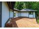 Spacious brick patio nestled in a verdant backyard with mature trees at 4275 Herman Sipe Rd, Conover, NC 28613
