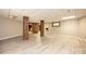 Large basement featuring sleek flooring and rustic brick structural support at 4275 Herman Sipe Rd, Conover, NC 28613