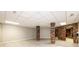 Basement with sleek flooring, painted walls and exposed brick pillars at 4275 Herman Sipe Rd, Conover, NC 28613