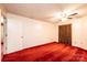 Cozy bedroom with red carpet and ample closet space at 4275 Herman Sipe Rd, Conover, NC 28613