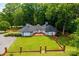 Expansive front yard of a ranch-style home with a gray roof and brick border at 4275 Herman Sipe Rd, Conover, NC 28613