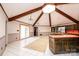 Spacious kitchen featuring a skylight, wooden beams, and a functional island with appliances at 4275 Herman Sipe Rd, Conover, NC 28613