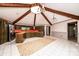 Bright, open kitchen featuring wooden beams, tiled flooring, an island, and stainless steel appliances at 4275 Herman Sipe Rd, Conover, NC 28613