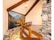 Open living room with stone accent wall and beautiful mountain mural feature at 4275 Herman Sipe Rd, Conover, NC 28613