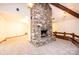 Living room featuring a stone fireplace and a unique architectural design with exposed beams and stone accents at 4275 Herman Sipe Rd, Conover, NC 28613