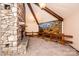 Charming living room featuring a stone fireplace and a cozy atmosphere with a scenic mural at 4275 Herman Sipe Rd, Conover, NC 28613