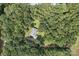 Aerial view of a home nestled in a lush forest, surrounded by trees and greenery at 4824 Waxhaw Farms Rd, Waxhaw, NC 28173
