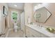 Bright bathroom featuring a stylish mirror, white vanity, and tiled flooring at 4824 Waxhaw Farms Rd, Waxhaw, NC 28173